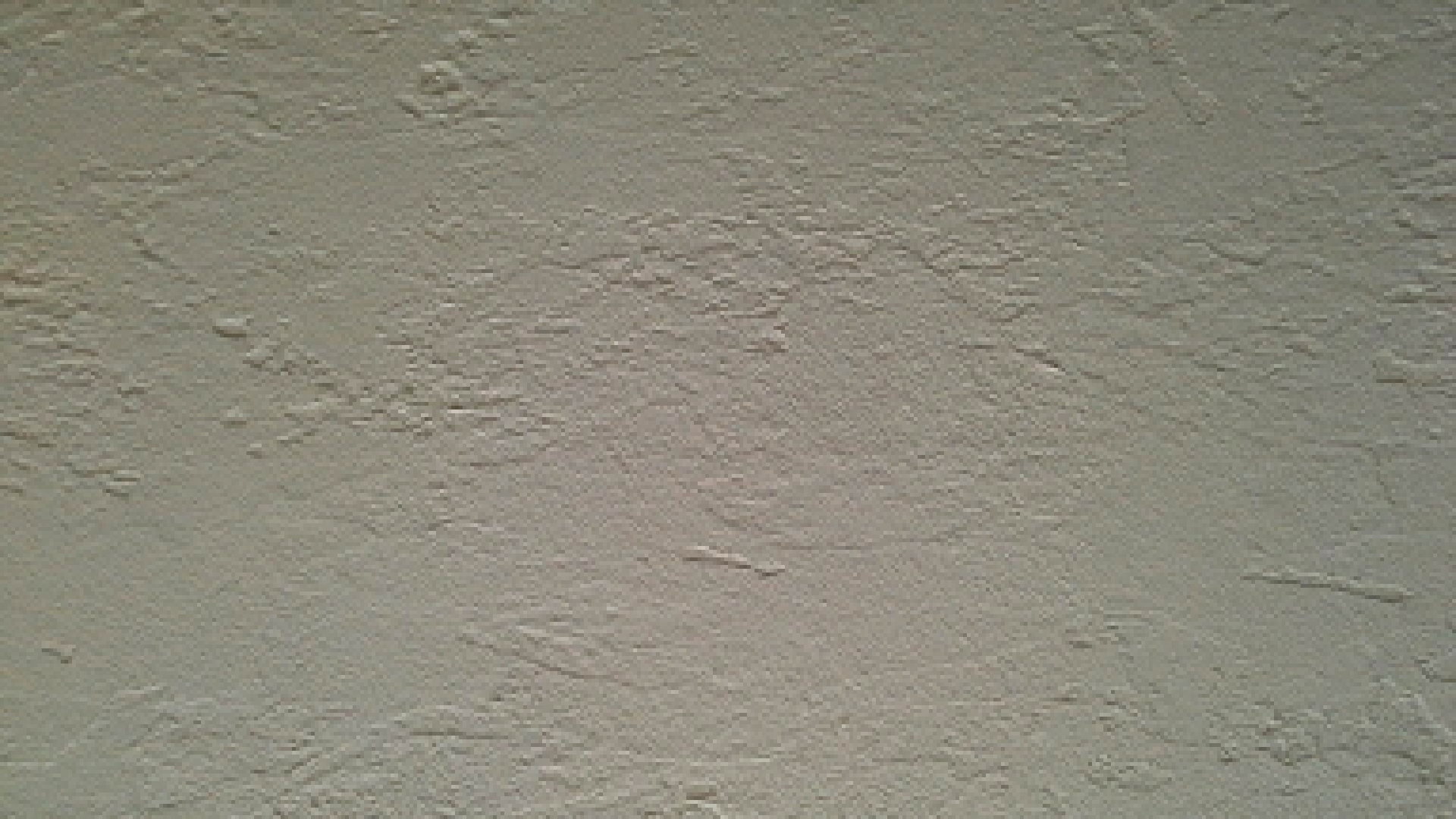 The method of priming a concrete wall before applying the finish
