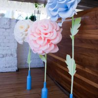 blue paper flowers in the facade of the festive hall photo