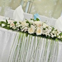 unusual decoration of the wedding hall with ribbons photo