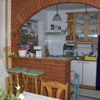 the idea of a beautiful living room design with arch photo