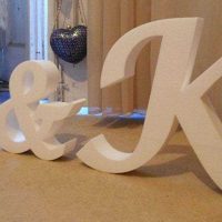the idea of using decorative letters in the style of a living room picture