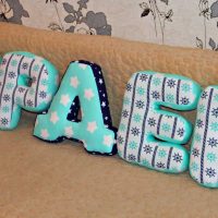 the idea of using decorative letters in the style of a bedroom photo