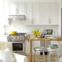 White set and wooden table in the design of the kitchen
