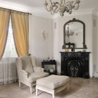 Cozy living room with fireplace and window.