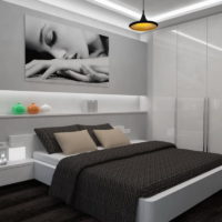 Couvre-lit noir sur le lit dans la chambre 12 mètres carrés