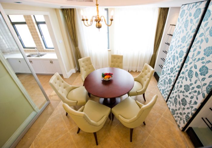 Round dining table in the dining area of a studio apartment