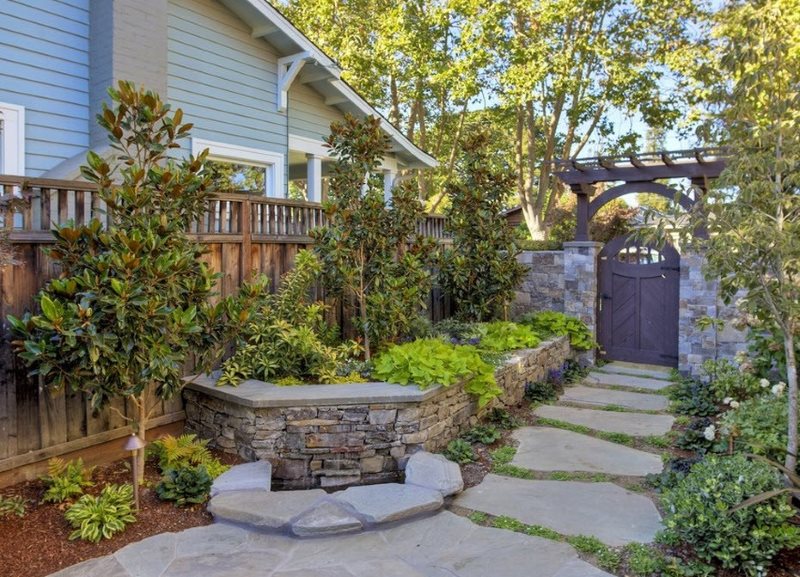 Path made of natural stone from the porch to the gate