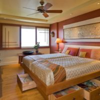 Bed with drawers in the bedroom interior