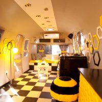 Checked floor and bee honeycombs in interior design