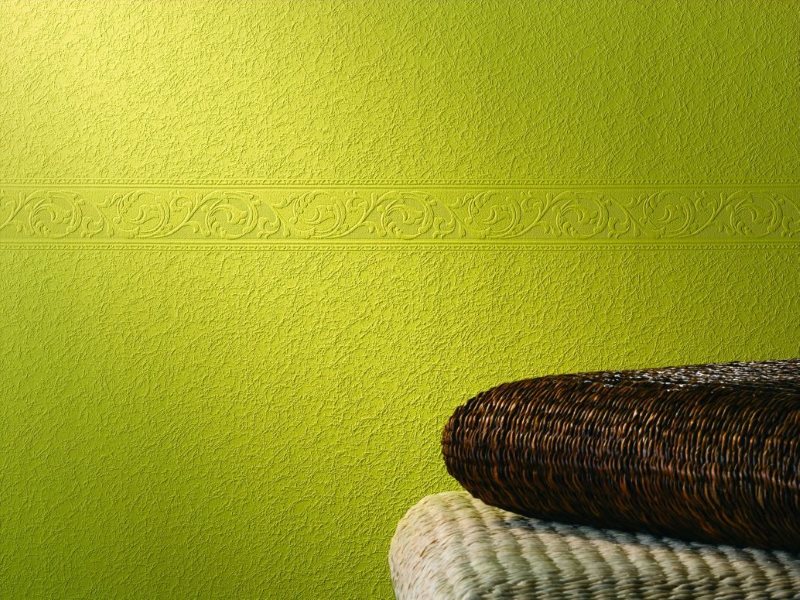 Green wallpaper with embossed pattern