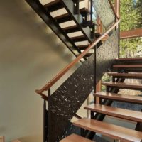 Metal staircase in the design of a private house