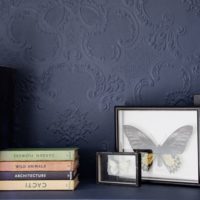 Bookshelf on a dark purple wall