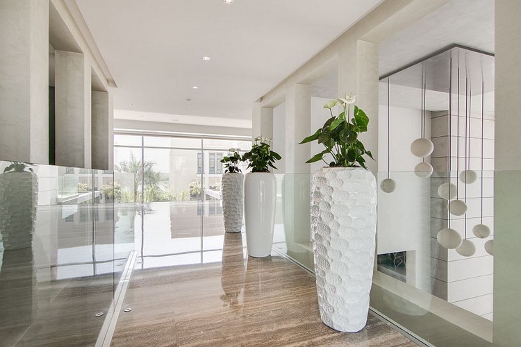 Decorative vases on the floor of a spacious hall