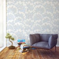 Floral ornaments on the wallpaper in the living room of a city apartment