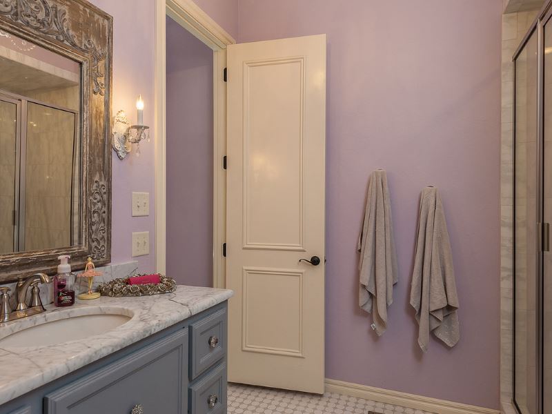 Light-colored plastic door in the interior of the bathroom