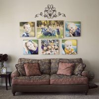 Symmetrical arrangement of photos above the sofa