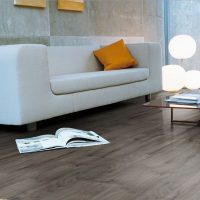 White sofa on the dark floor in the living room