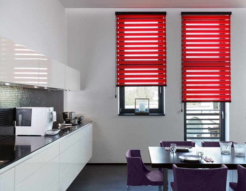 Kitchen interior with red curtains on the windows