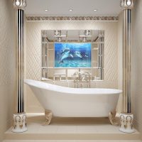 White acrylic bathtub on tiled pedestal