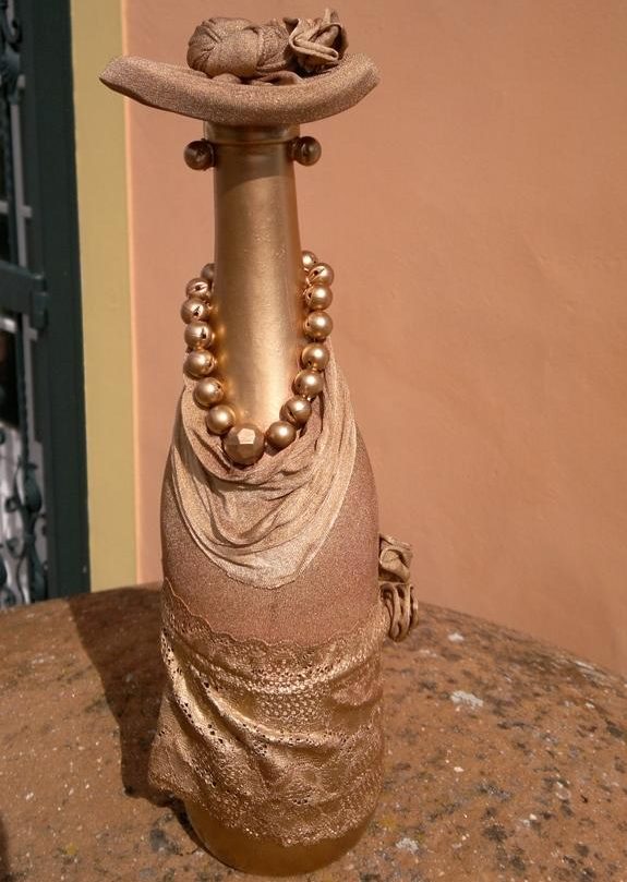 Decorative lady in a hat from a bottle and tights