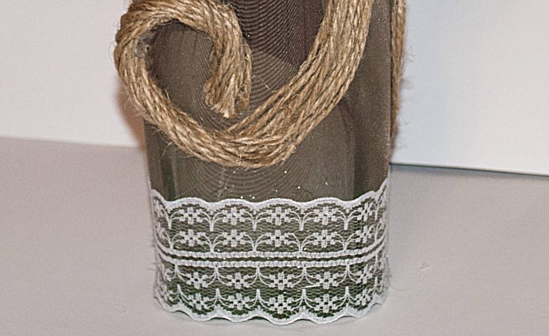 Lace at the bottom of a glass bottle