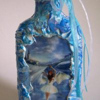 Blue bow on the neck of a cognac bottle