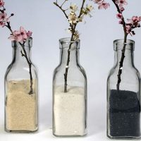 Flowering twigs in cereal bottles