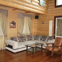 Corner sofa with striped pillows.