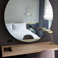 Large mirror on the black wall