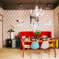 Red sofa and colorful chairs