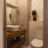 Porcelain washbasin on a wooden countertop