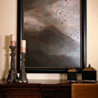 Picture in a black frame made of wood